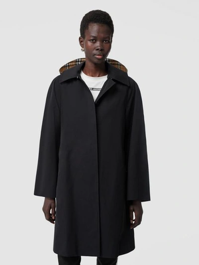 Shop Burberry Detachable Hood Tropical Gabardine Swing Coat In Black