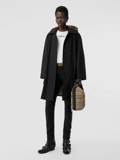 Shop Burberry Detachable Hood Tropical Gabardine Swing Coat In Black