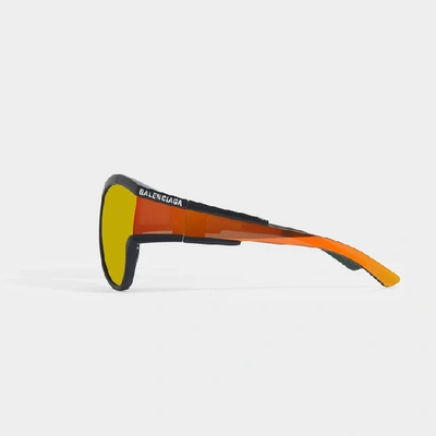 Shop Balenciaga Unlimited Rectangle Sunglasses In Orange Injection With Orange Lenses