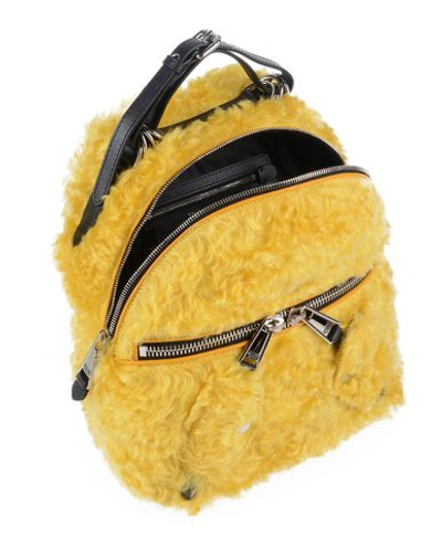 Shop Moschino Backpacks & Fanny Packs In Yellow