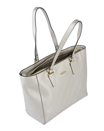 Shop Guess Handbags In Silver