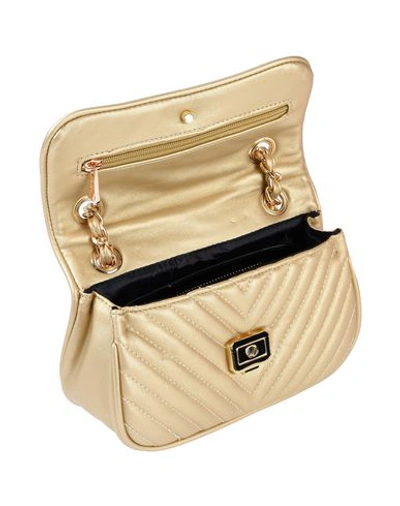 Shop Mia Bag Cross-body Bags In Gold