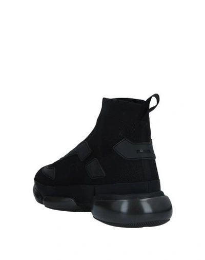 Shop Prada Sneakers In Black