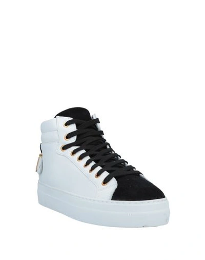 Shop Moschino Sneakers In White