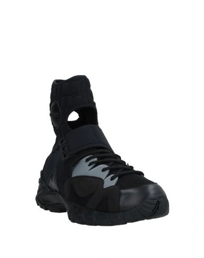 Shop Versace Sneakers In Black