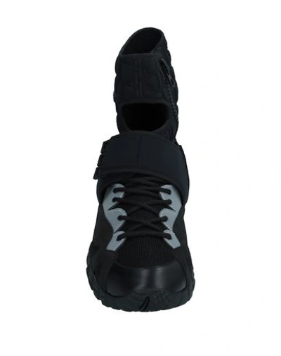 Shop Versace Sneakers In Black