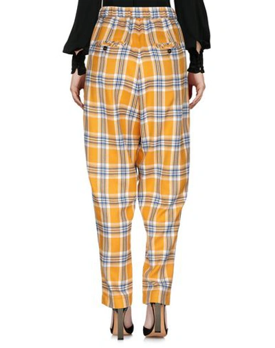 Shop Neul Casual Pants In Yellow