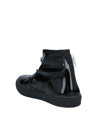 Shop Boutique Moschino Ankle Boots In Black