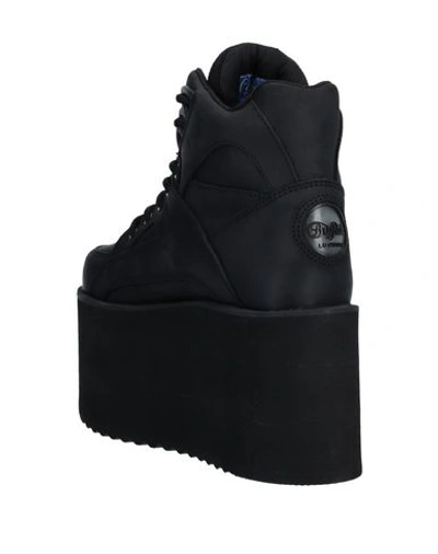 Shop Buffalo Sneakers In Black