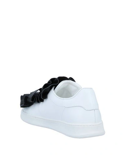 Shop Pokemaoke Sneakers In White