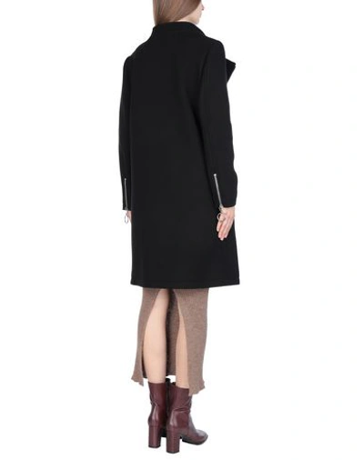 Shop Moschino Coats In Black