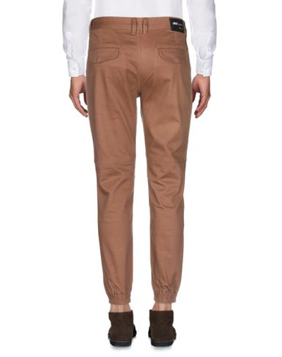 Shop Publish Casual Pants In Brown