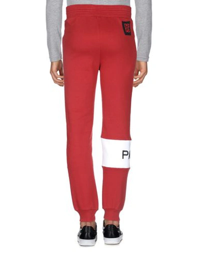 Shop Givenchy Casual Pants In Brick Red