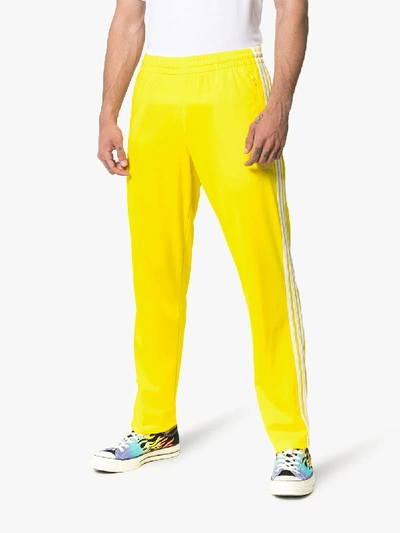 yellow adidas firebird track pants