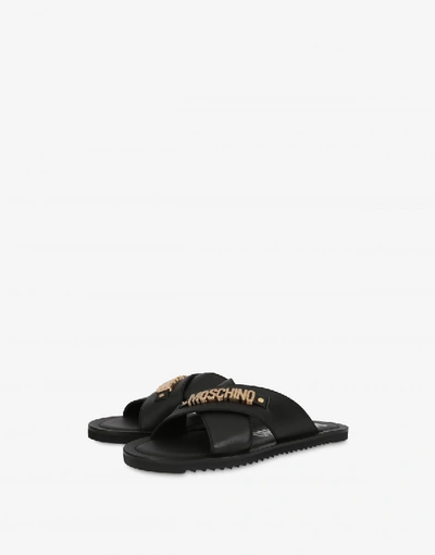 Shop Moschino Crossed Sandals With Lettering Logo In Black