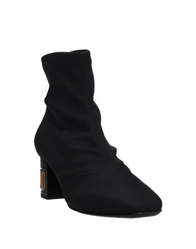 Shop Moschino Ankle Boot In Black