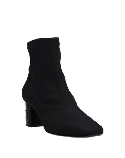 Shop Moschino Ankle Boot In Black
