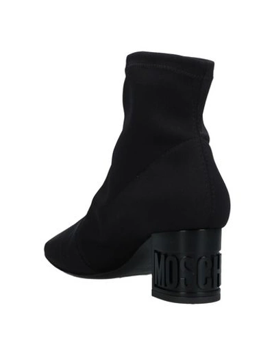 Shop Moschino Ankle Boot In Black