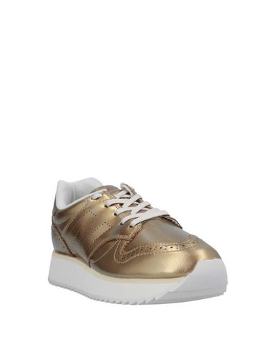 Shop New Balance Sneakers In Gold