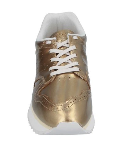 Shop New Balance Sneakers In Gold