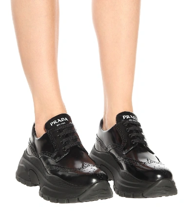 Shop Prada Leather Sneakers In Black