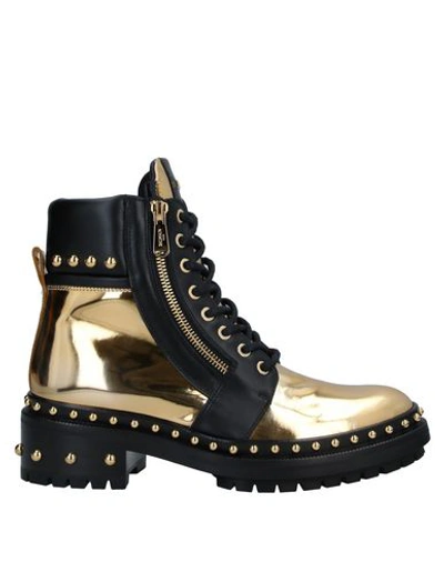 Shop Balmain Ankle Boots In Gold