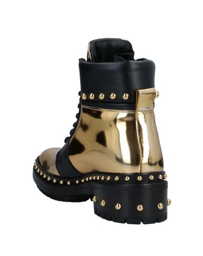 Shop Balmain Ankle Boots In Gold