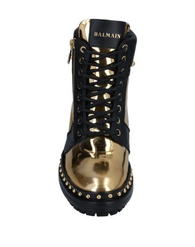 Shop Balmain Ankle Boots In Gold