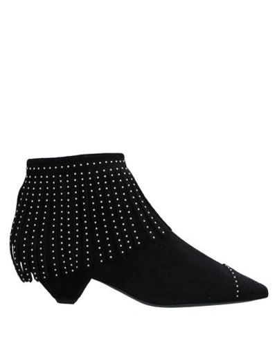 Shop Saint Laurent Ankle Boots In Black