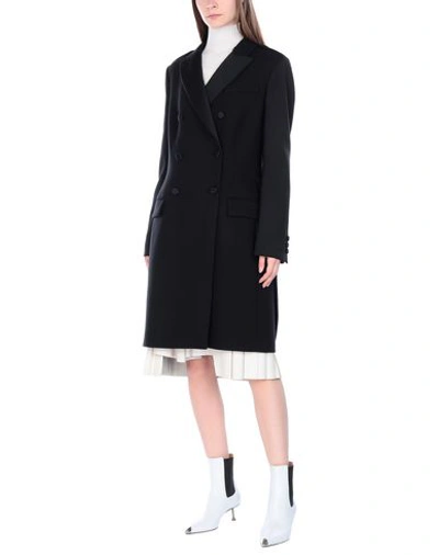 Shop Moschino Coat In Black