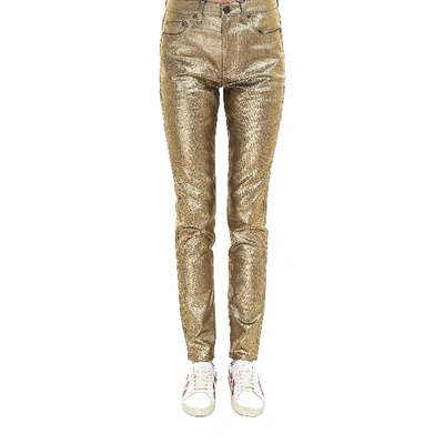Shop Saint Laurent Metallic Skinny Jeans In Gold