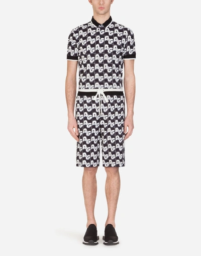 Shop Dolce & Gabbana Jersey Jogging Shorts With All-over Dg Print In Black