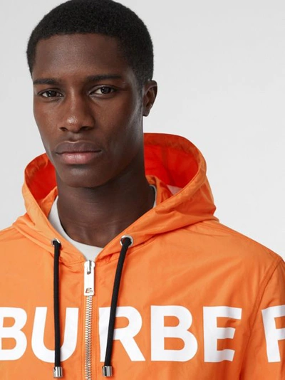 Shop Burberry Horseferry Print Nylon Hooded Jacket In Bright Orange