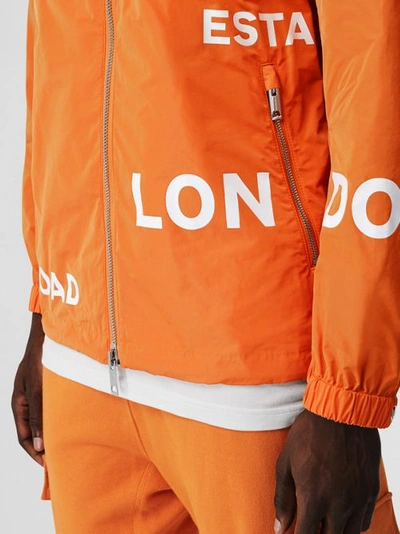 Shop Burberry Horseferry Print Nylon Hooded Jacket In Bright Orange