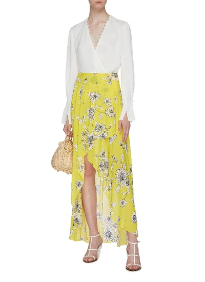 Shop Alice And Olivia 'kirstie' Floral Print Mock Wrap High-low Skirt In Yellow