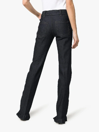 Shop Prada Belted Ruffle Hem Jeans In Blue