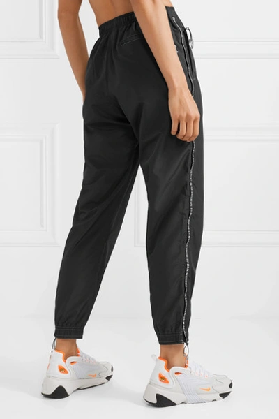Shop Adam Selman Sport Crystal-embellished Shell Track Pants In Black