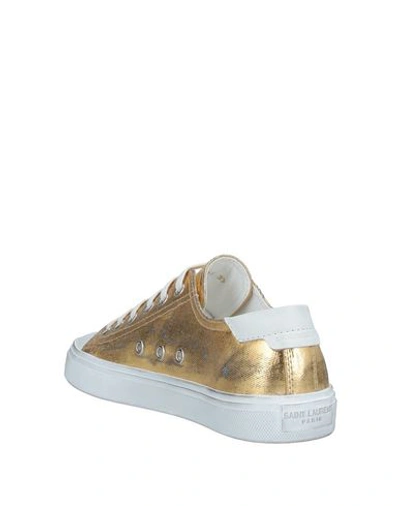 Shop Saint Laurent Sneakers In Gold