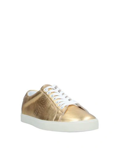 Shop Celine Sneakers In Gold