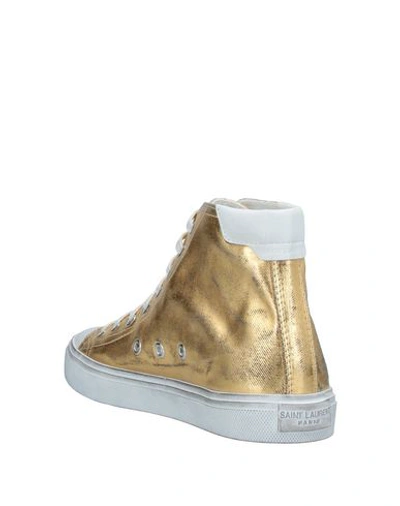 Shop Saint Laurent Sneakers In Gold