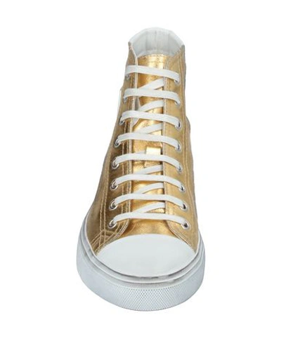 Shop Saint Laurent Sneakers In Gold