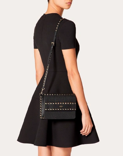 Shop Valentino Garavani Small Rockstud Grainy Leather Crossbody Bag In Black