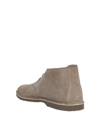 Shop Guess Boots In Beige