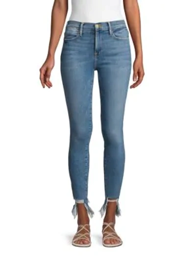 Shop Frame Distressed Skinny Jeans In Medium Blue