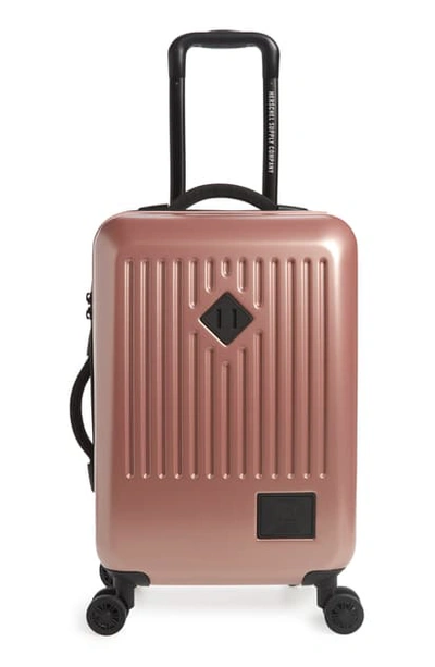 Shop Herschel Supply Co Small Trade 23-inch Rolling Suitcase - Pink In Ash Rose Metallic
