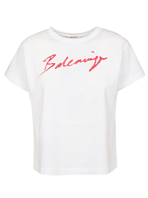 white graphic tee with red writing