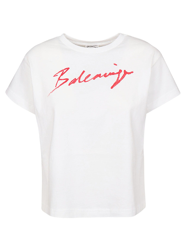 white t shirt with red writing