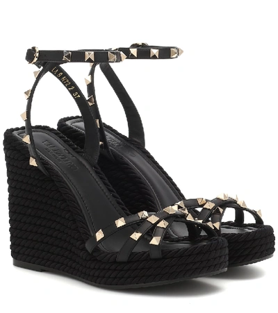 Shop Valentino Rockstud Torchon Leather Wedge Sandals In Black