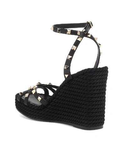 Shop Valentino Rockstud Torchon Leather Wedge Sandals In Black