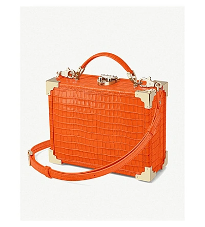 Shop Aspinal Of London Trunk Mini Crocodile-embossed Leather Clutch Bag In Amber